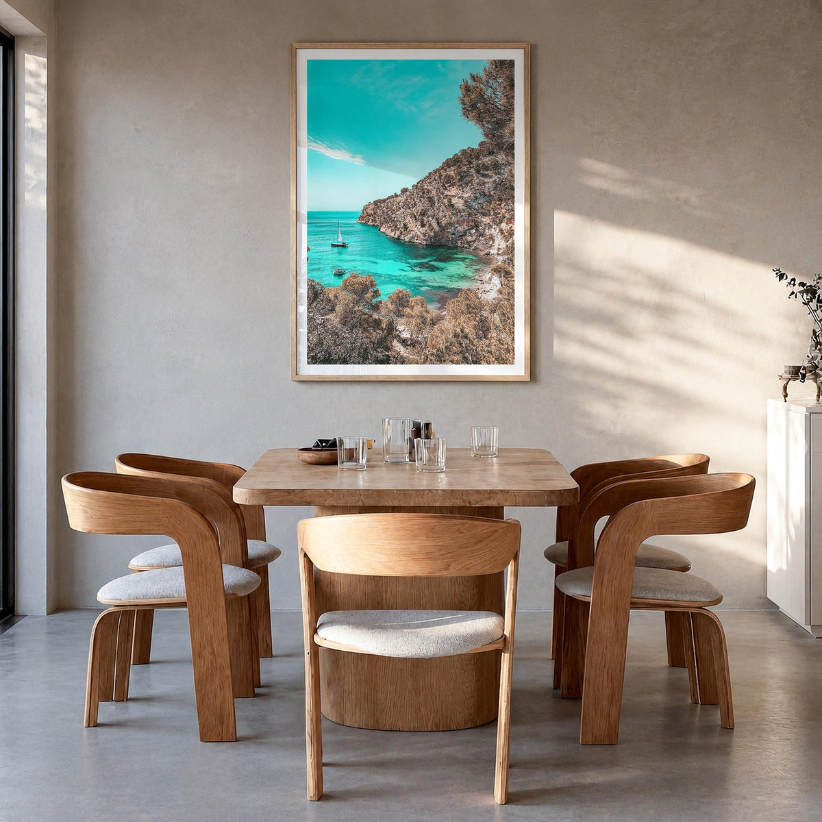 Cala Blanca colorful photo poster of Spain – vertical wall art in natural wood frame with white border, hanging on wall
