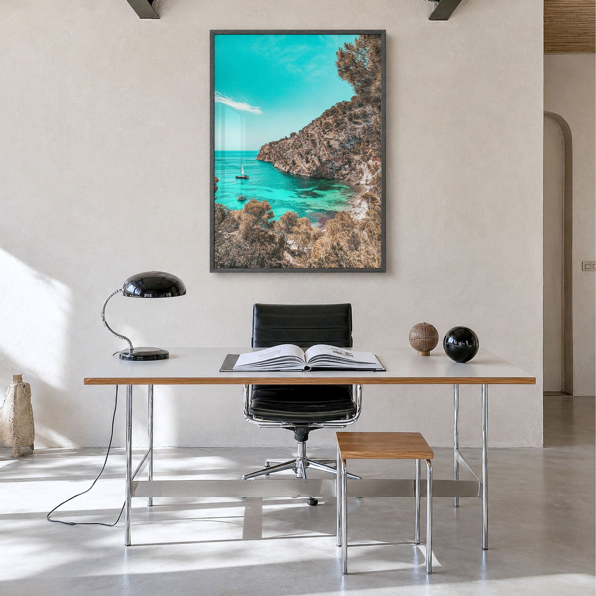 Cala Blanca Photo Poster in a black wood frame, hanging in a minimalist home office, full image (no border)