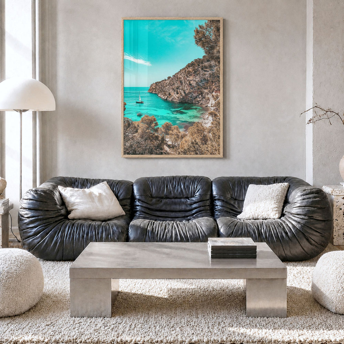 Cala Blanca Photo Poster in a natural wood frame, hanging in a living room, full image (no border)