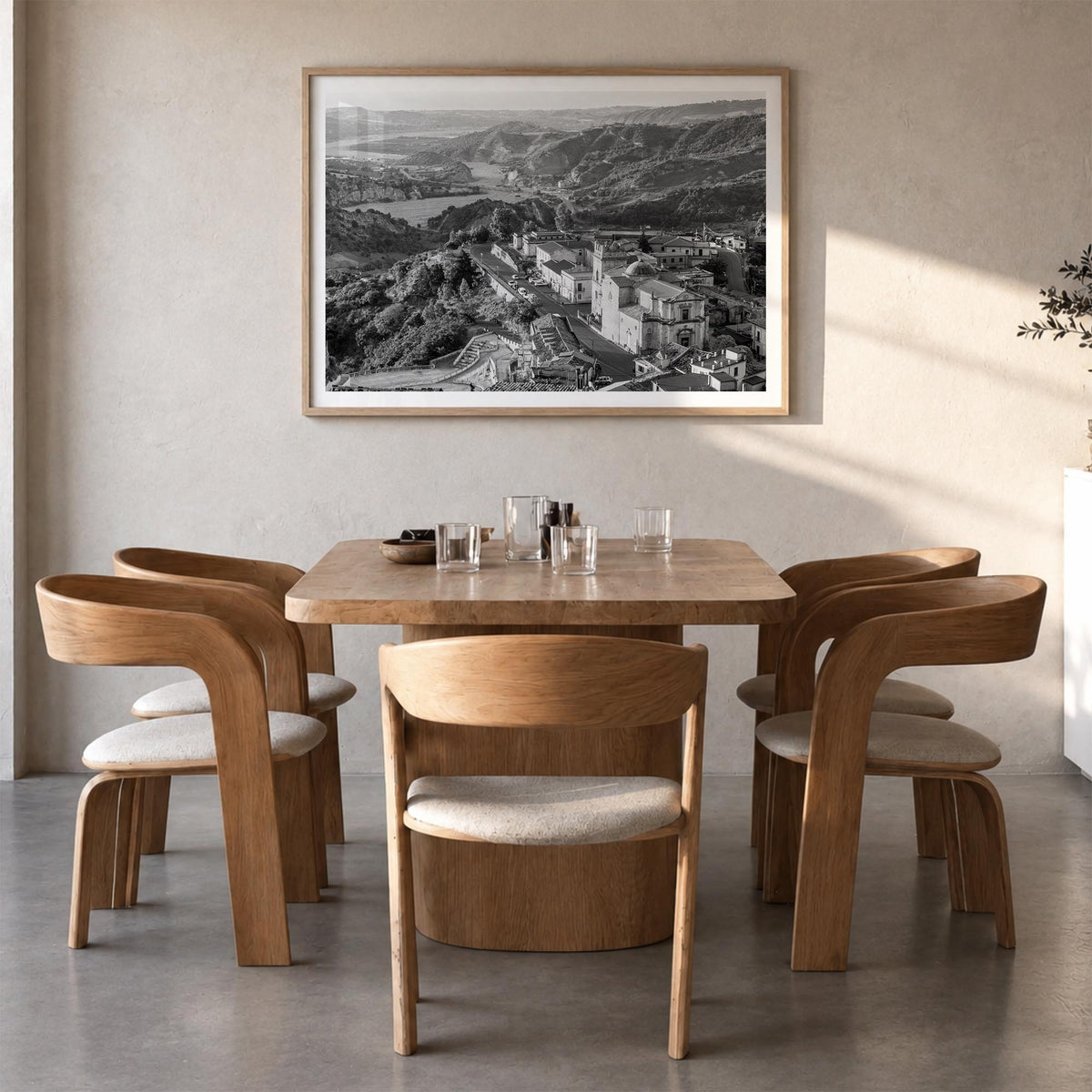 Calabria black & white photo poster of Italy – horizontal wall art in natural wood frame with white border, hanging on wall