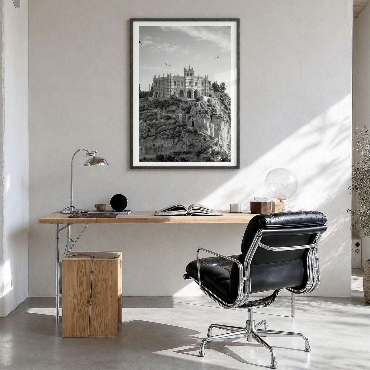 Calabria Photo Poster in a black wood frame, hanging in a bright home office, white border