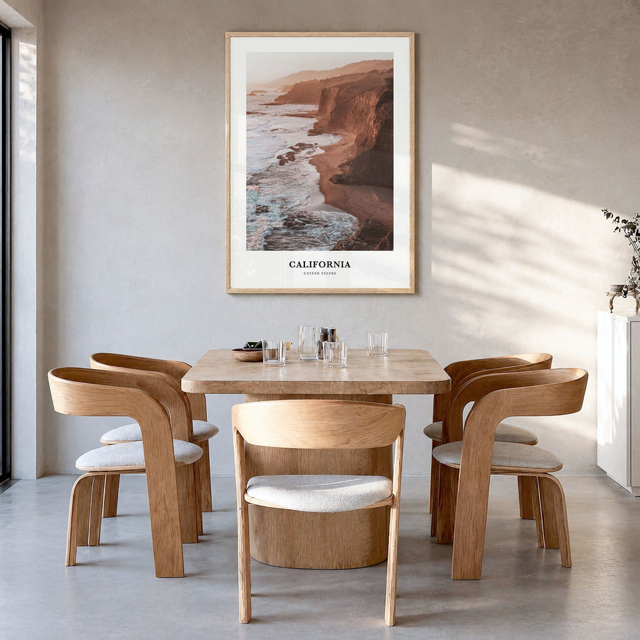California Classic Poster in a natural wood frame, hanging in a dining room
