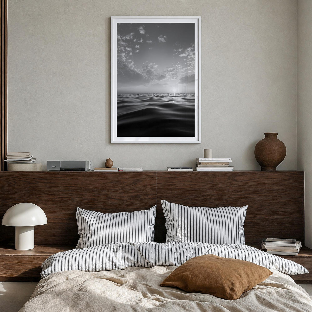 Calm Sunset black & white photo poster – vertical wall art in white wood frame with white border, hanging on wall