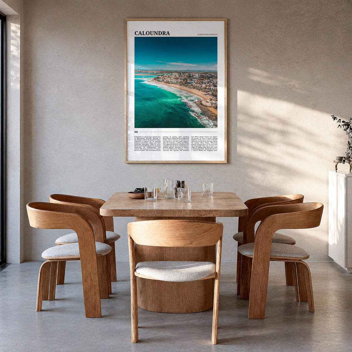 Caloundra colorful travel poster of Australia – vertical wall art in natural wood frame, hanging on wall