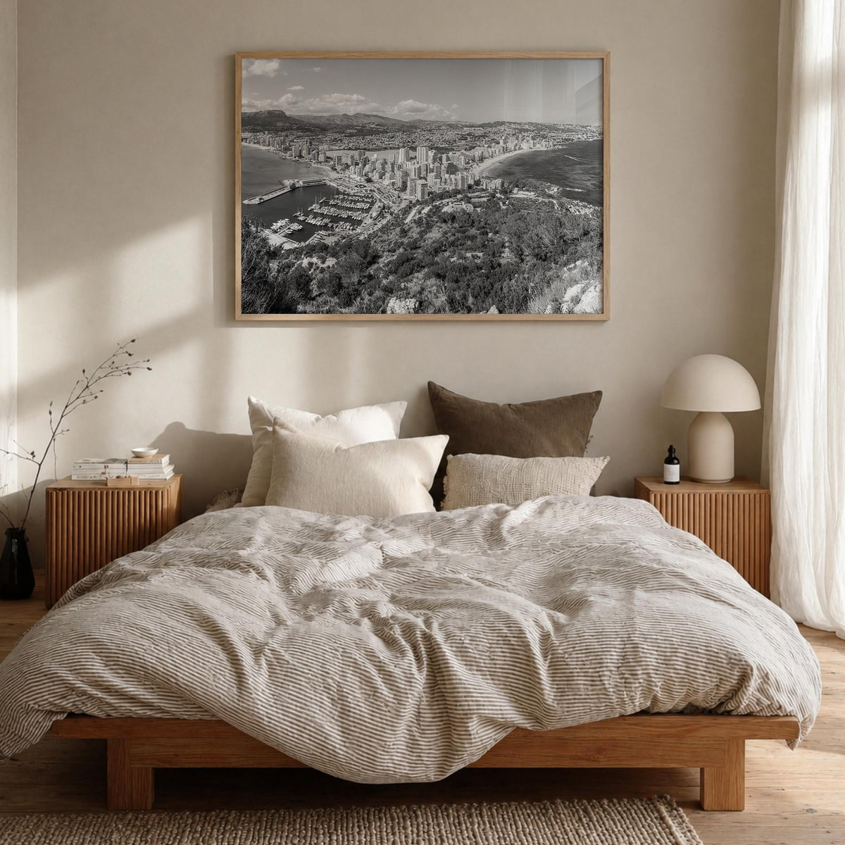 Calpe black & white photo poster of Spain – horizontal wall art in natural wood frame, hanging on wall