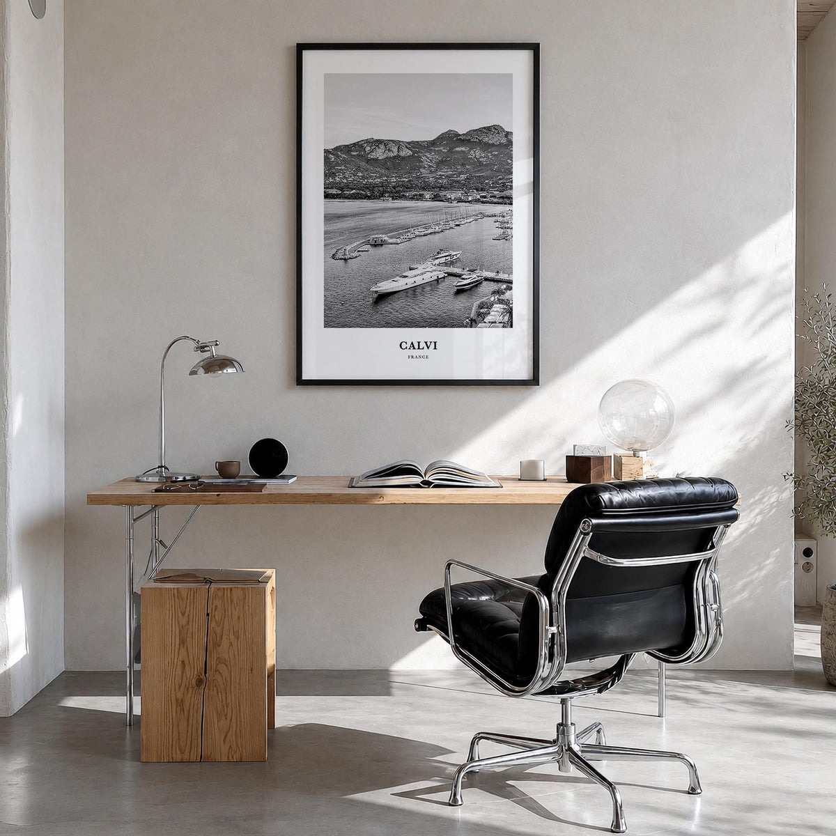 Calvi black & white classic poster of France – vertical wall art in black wood frame, hanging on wall