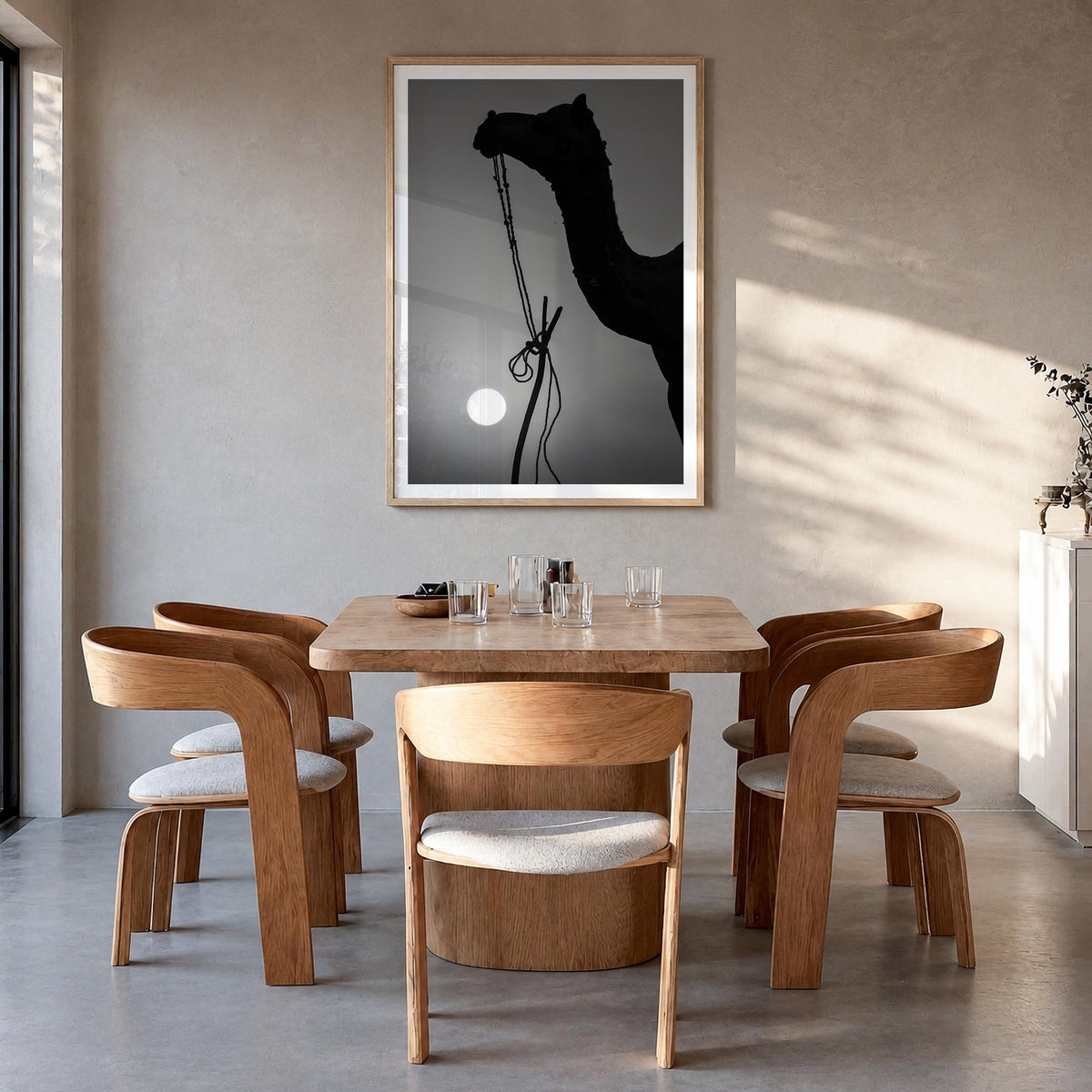 Camel Caravan no. 1 black & white photo poster – vertical wall art in natural wood frame with white border, hanging on wall