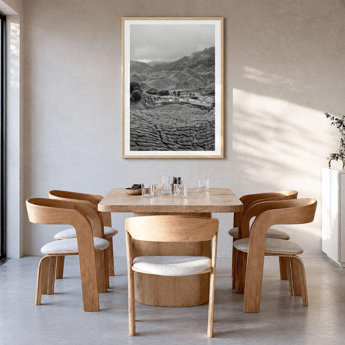 Cameroon Photo Poster in a natural wood frame, hanging in a dining room, white border