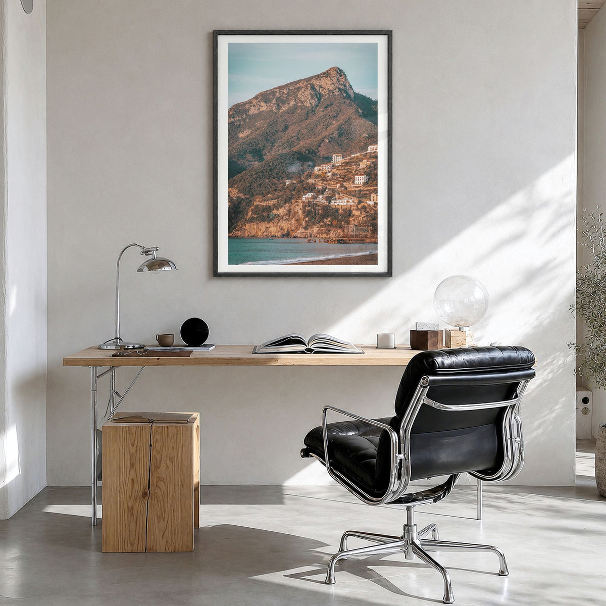 Campania Photo Poster in a black wood frame, hanging in a bright home office, white border