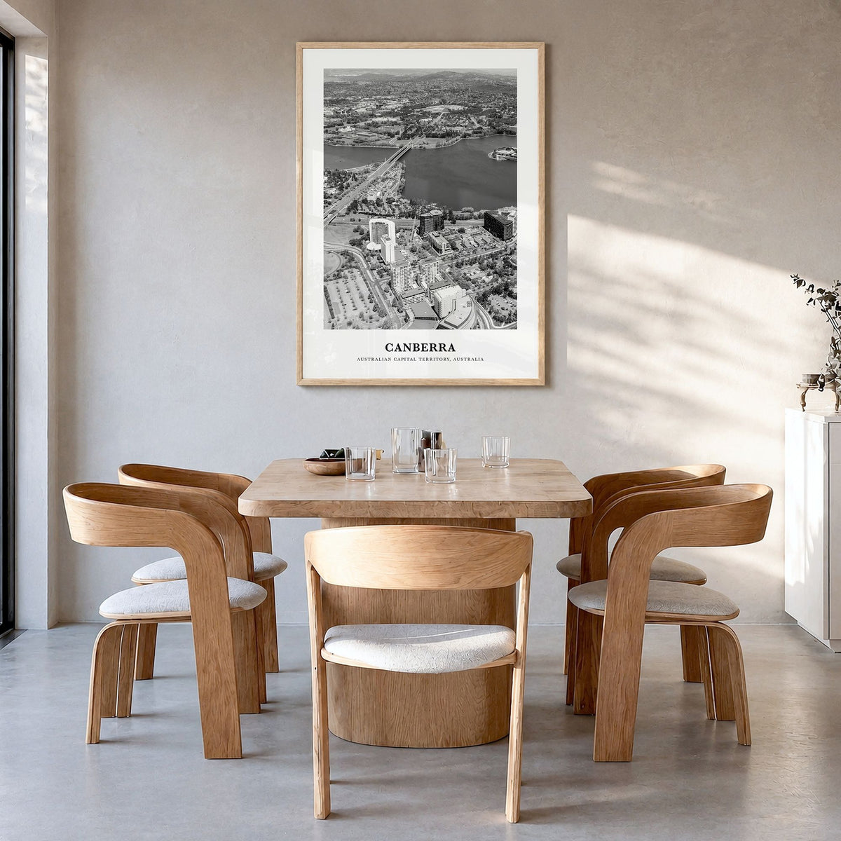 Canberra Classic Poster in a natural wood frame, hanging in a dining room