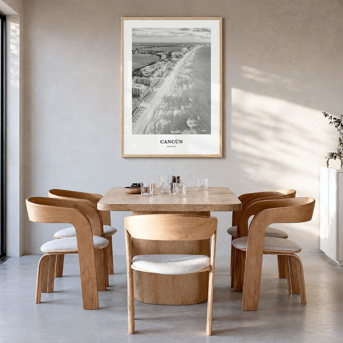 Cancún Classic Poster in a natural wood frame, hanging in a dining room