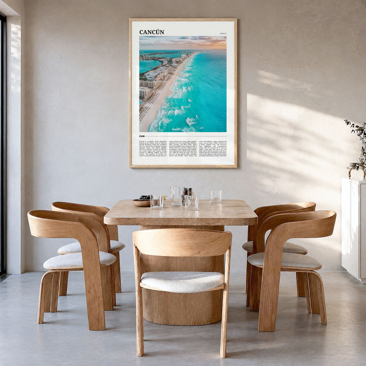Cancún Travel Poster in a natural wood frame, hanging in a dining room