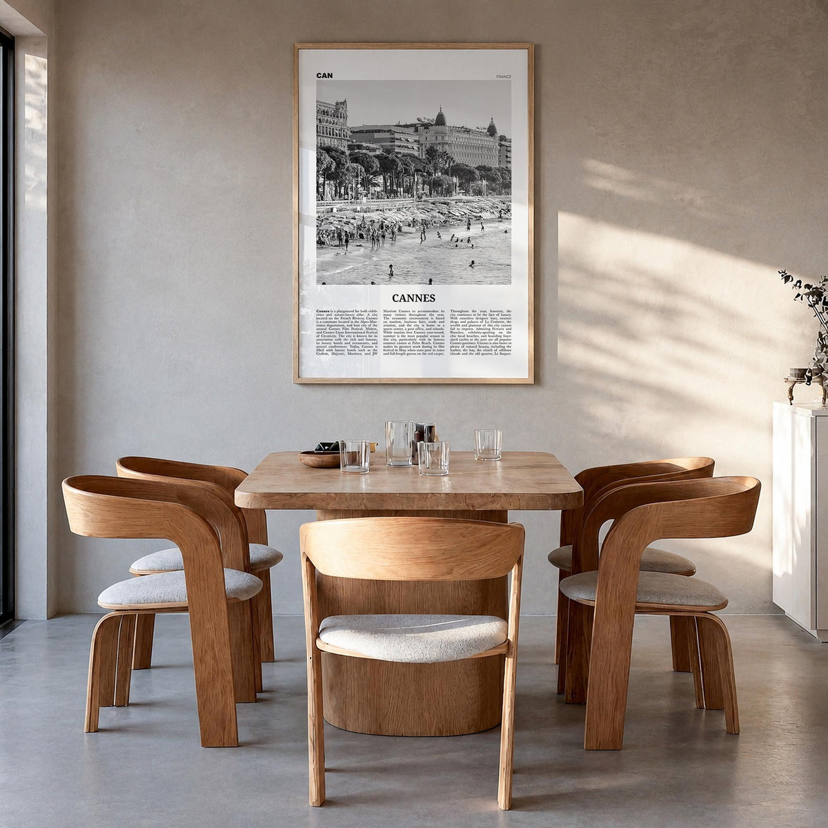 Cannes black & white newspaper poster of France – vertical wall art in natural wood frame, hanging on wall