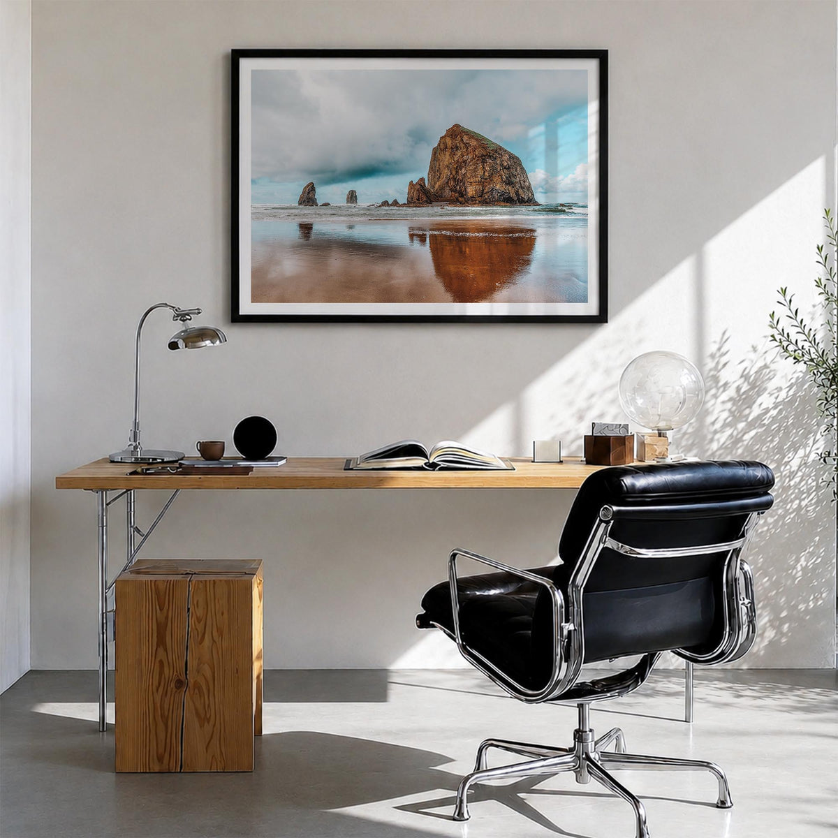 Cannon Beach colorful photo poster of Oregon, USA – horizontal wall art in black wood frame with white border, hanging on wal