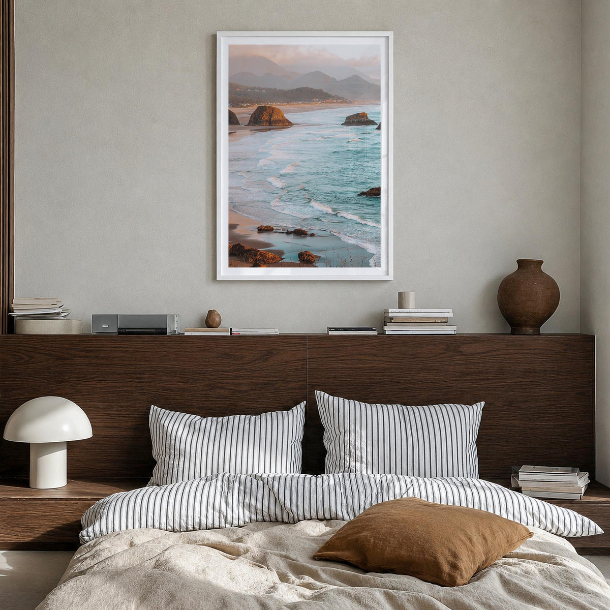 Cannon Beach colorful photo poster of Oregon, USA – vertical wall art in white wood frame with white border, hanging on wall