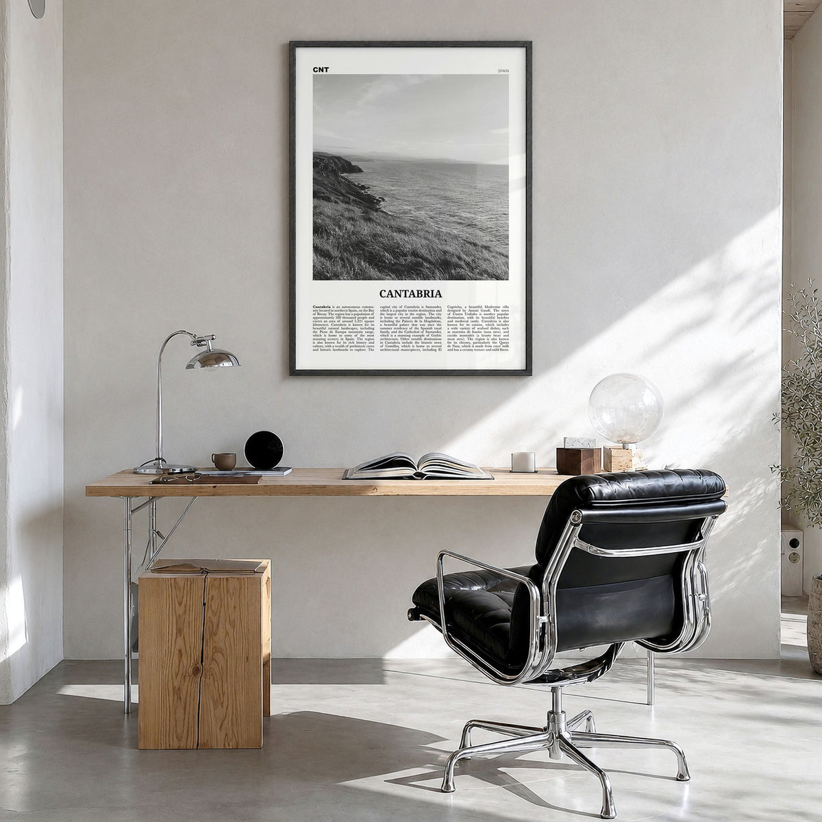 Cantabria Newspaper Poster in a black wood frame, hanging in a bright home office