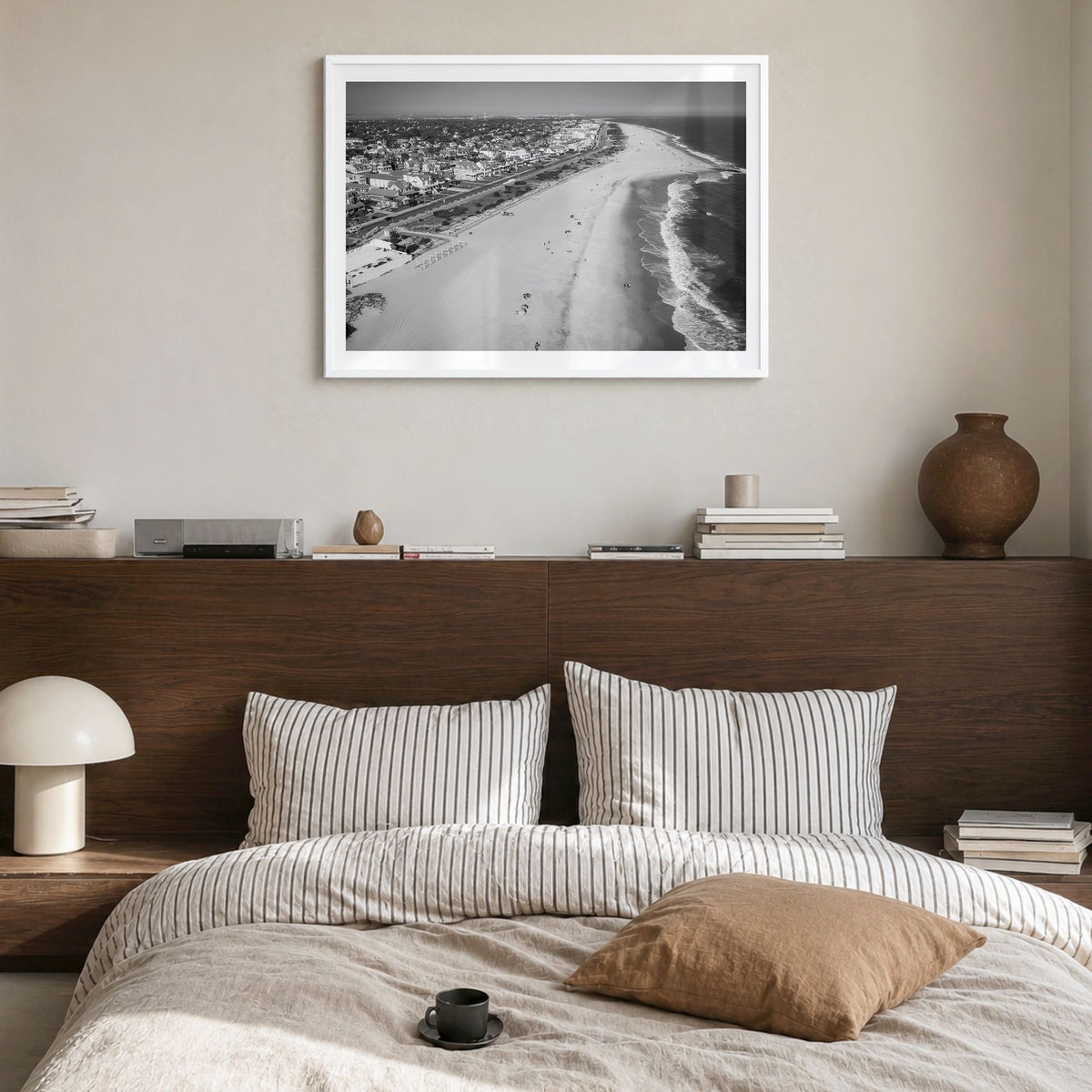 Cape May Photo Poster in a white wood frame, hanging in a bedroom, white border