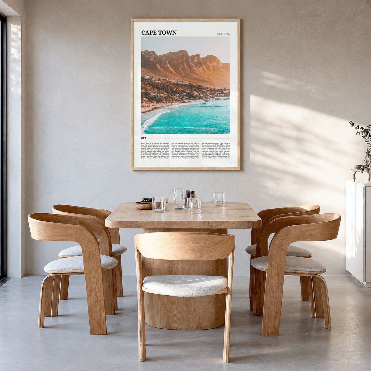 Cape Town Travel Poster in a natural wood frame, hanging in a dining room
