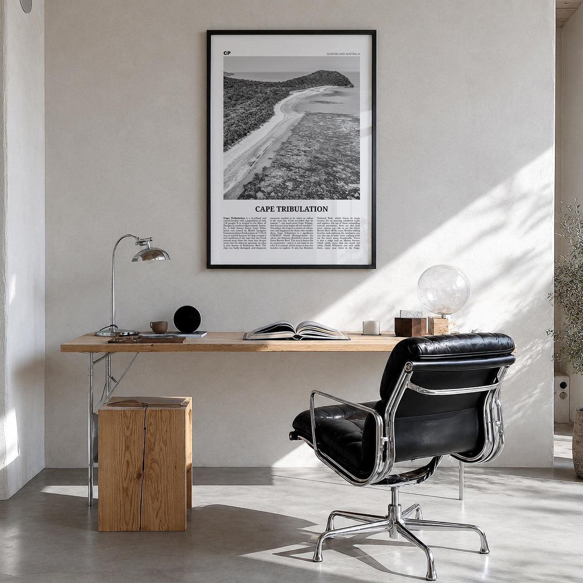 Cape Tribulation black & white newspaper poster of Australia – vertical wall art in black wood frame, hanging on wall