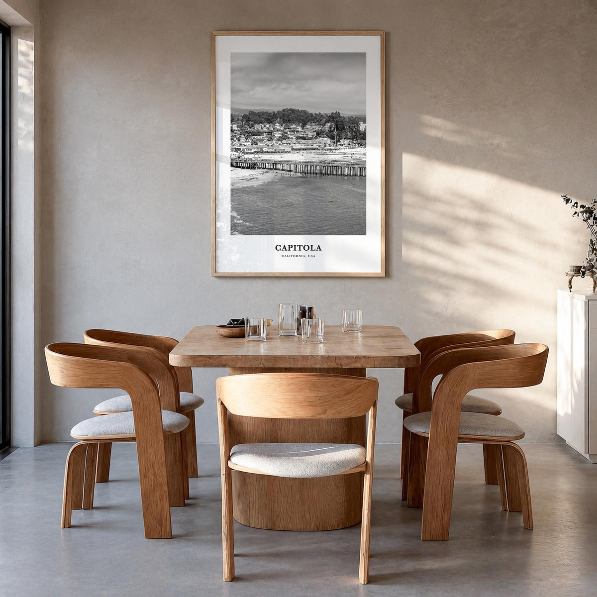 Capitola black & white classic poster of California, USA – vertical wall art in natural wood frame, hanging on wall
