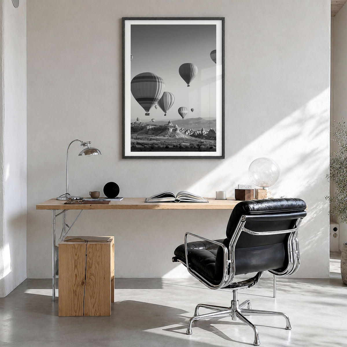 Cappadocia Photo Poster in a black wood frame, hanging in a bright home office, white border