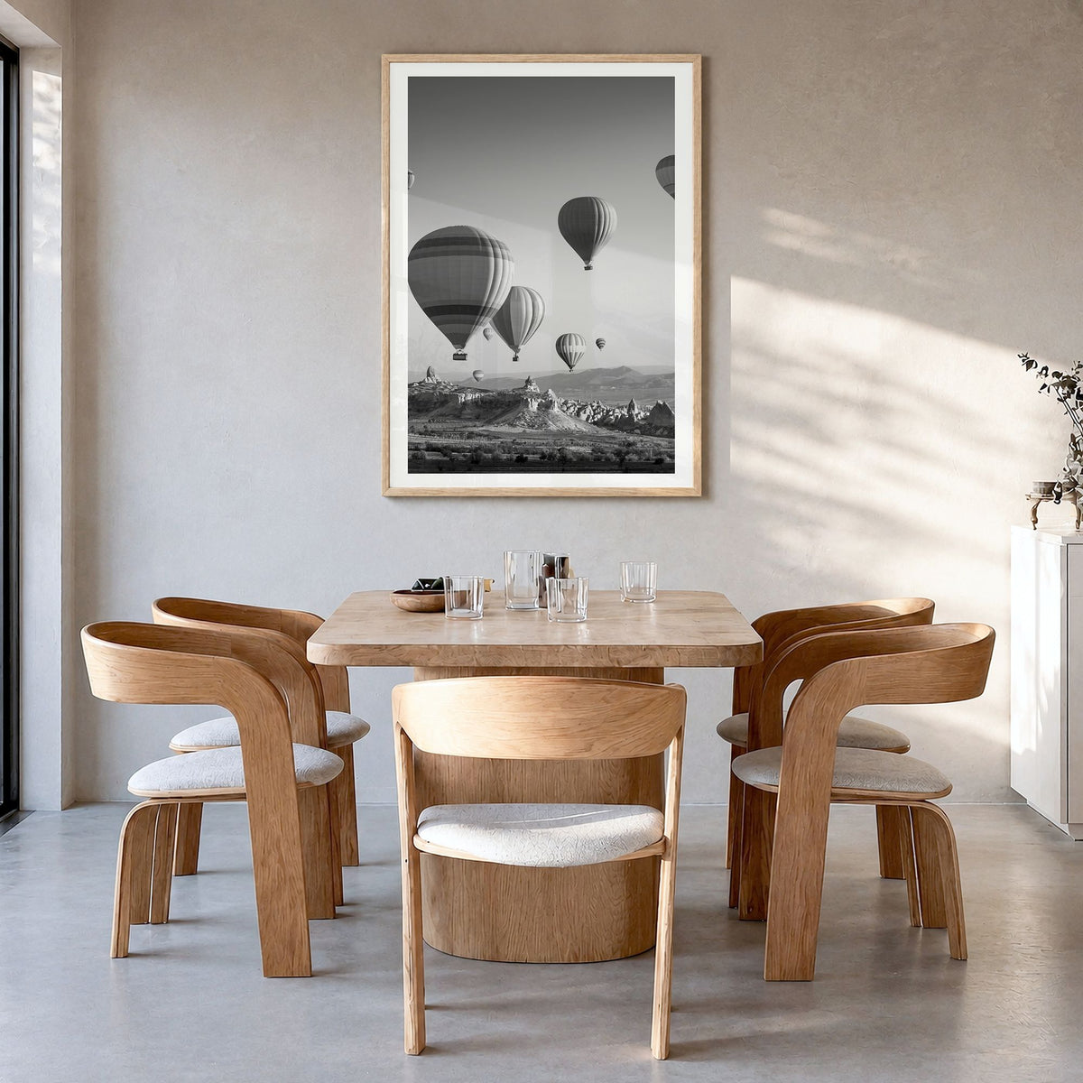 Cappadocia Photo Poster in a natural wood frame, hanging in a dining room, white border