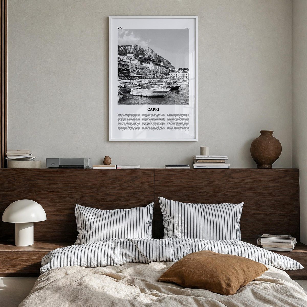Capri black & white newspaper poster of Italy – vertical wall art in white wood frame, hanging on wall