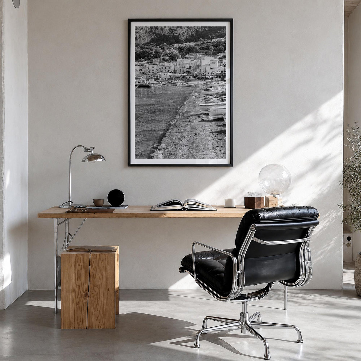 Capri black & white photo poster of Italy – vertical wall art in black wood frame with white border, hanging on wall
