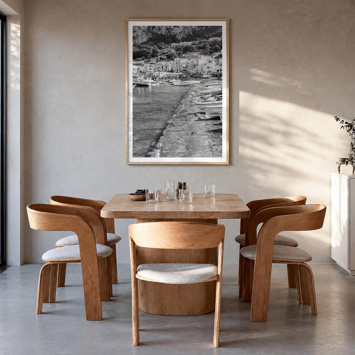 Capri black & white photo poster of Italy – vertical wall art in natural wood frame with white border, hanging on wall