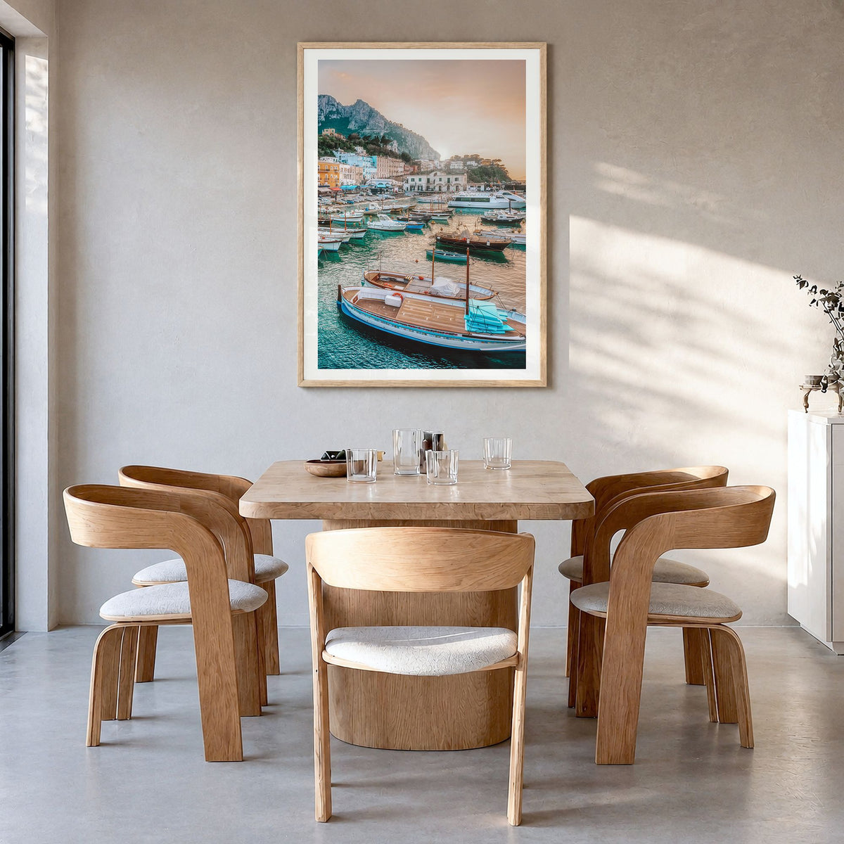 Capri Photo Poster in a natural wood frame, hanging in a dining room, white border