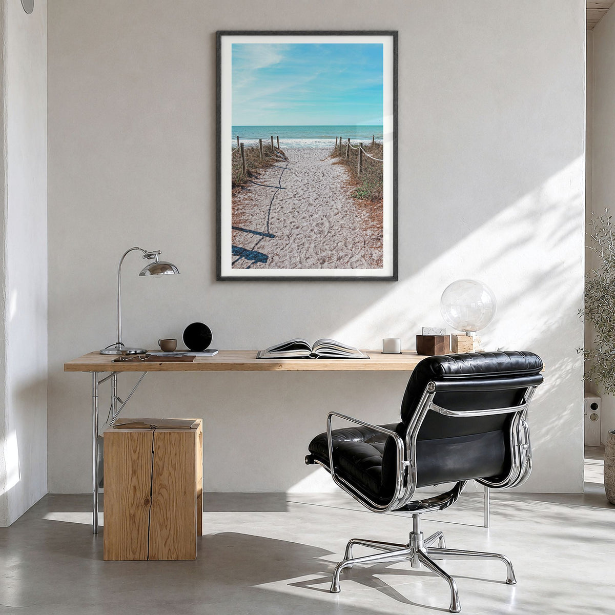 Captiva Photo Poster in a black wood frame, hanging in a bright home office, white border