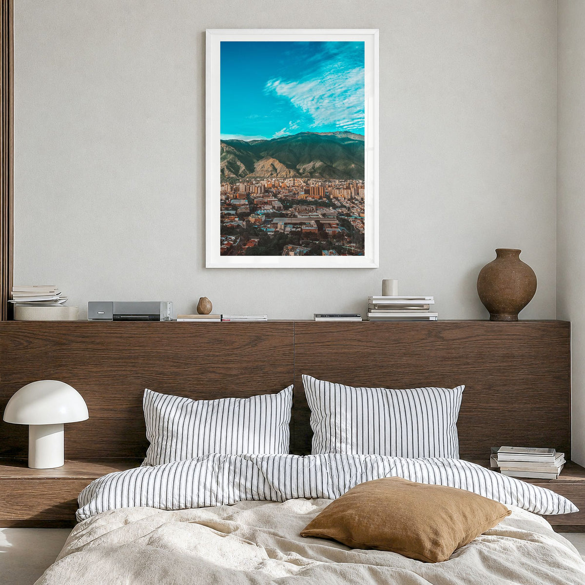 Caracas Photo Poster in a white wood frame, hanging in a bedroom, white border