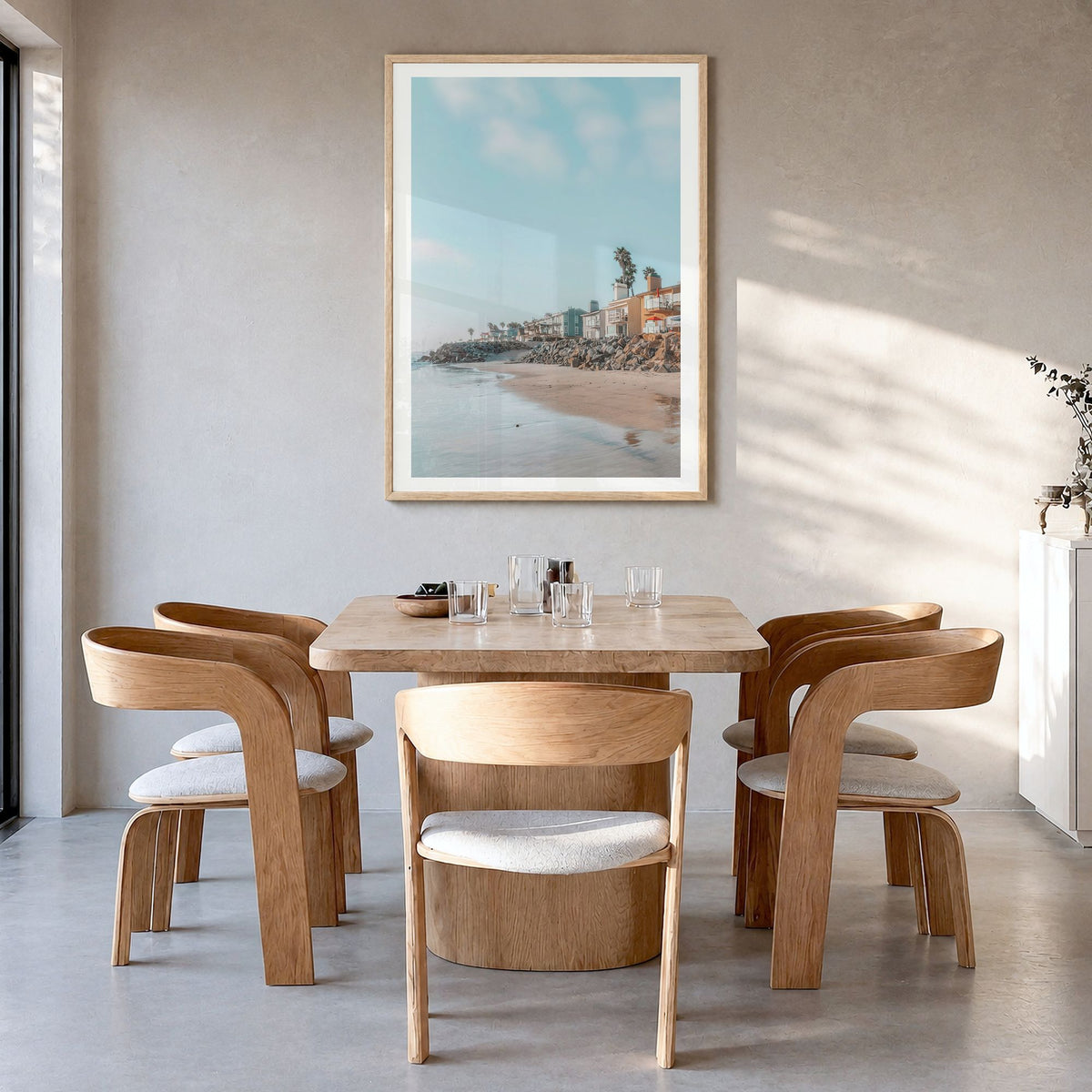 Carlsbad Photo No 1 Poster in a natural wood frame, hanging in a dining room, white border