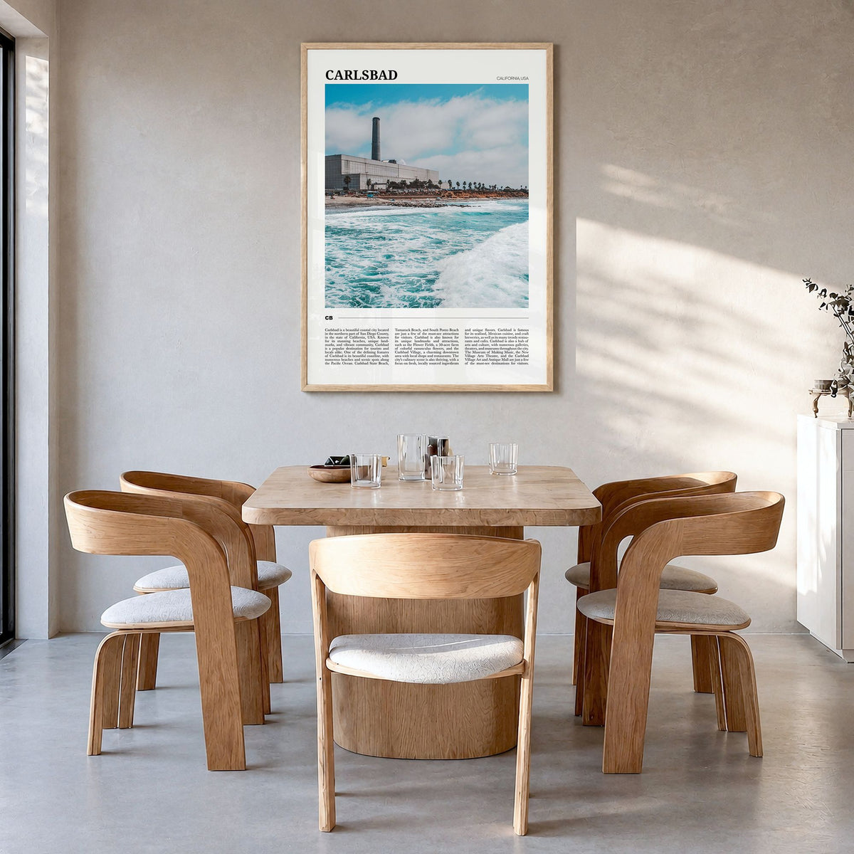 Carlsbad Travel No 1 Poster in a natural wood frame, hanging in a dining room
