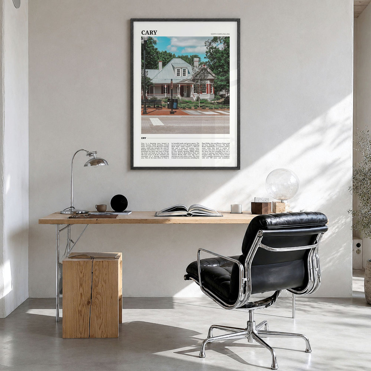 Cary Travel Poster in a black wood frame, hanging in a bright home office