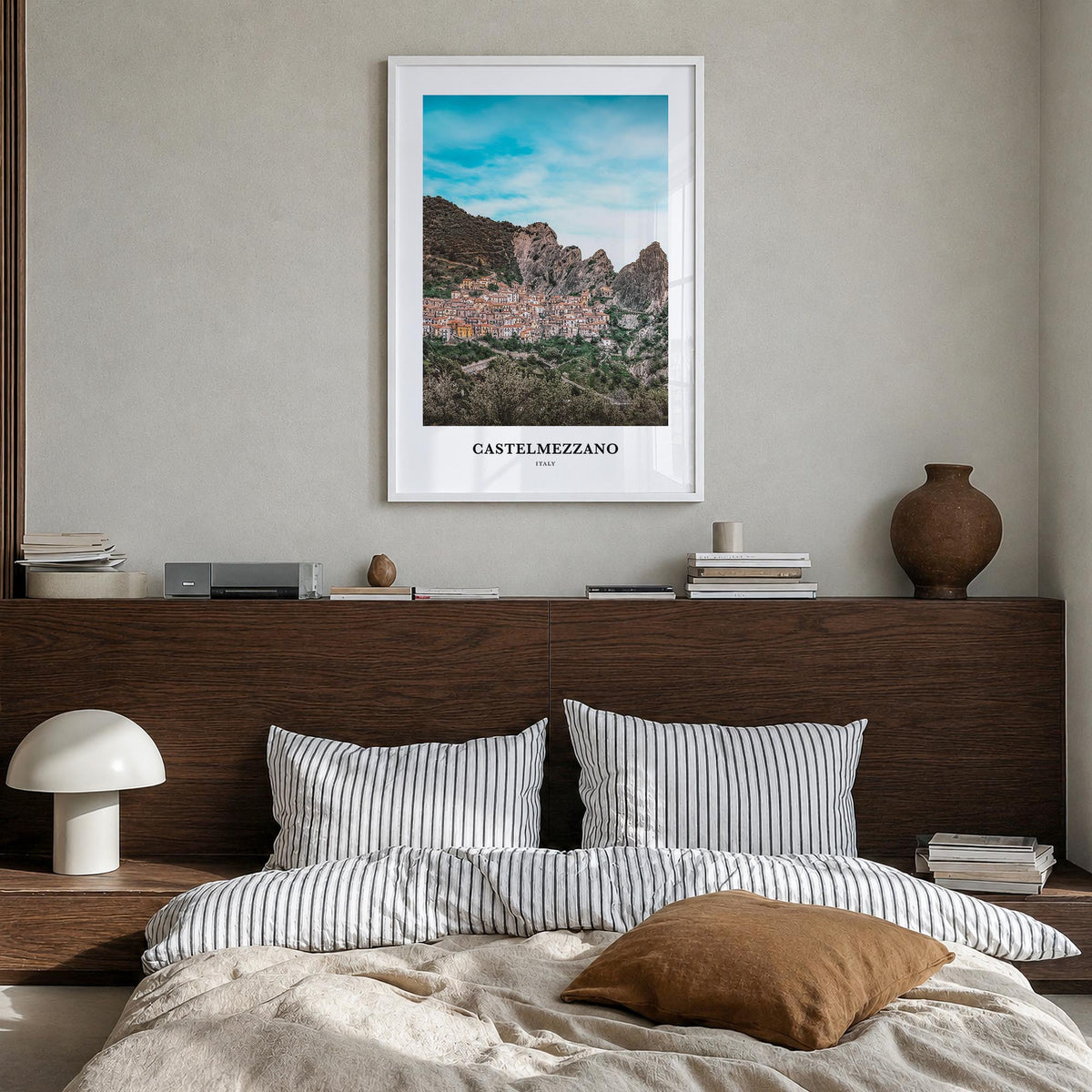 Castelmezzano colorful classic poster of Italy – vertical wall art in white wood frame, hanging on wall