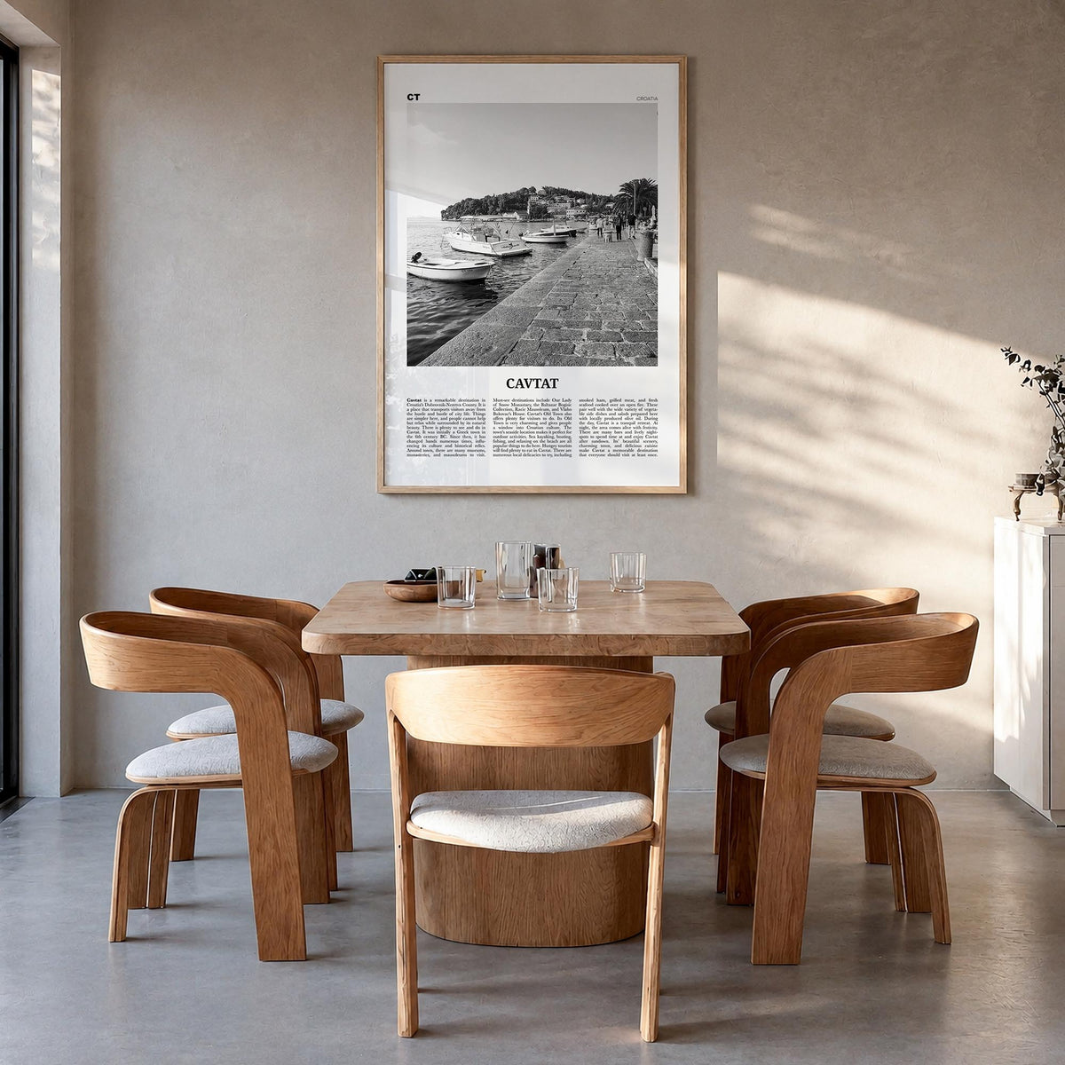 Cavtat black & white newspaper poster of Croatia – vertical wall art in natural wood frame, hanging on wall