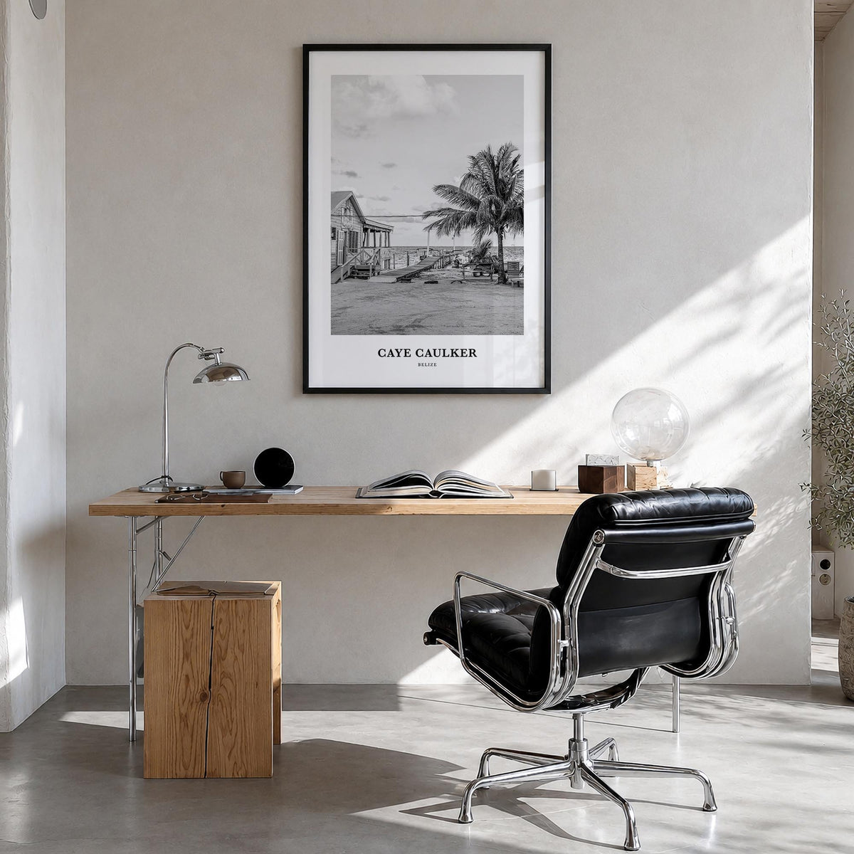 Caye Caulker black & white classic poster of Belize – vertical wall art in black wood frame, hanging on wall