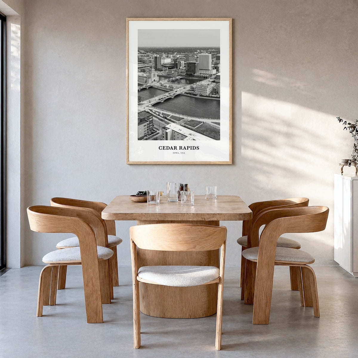 Cedar Rapids Classic Poster in a natural wood frame, hanging in a dining room