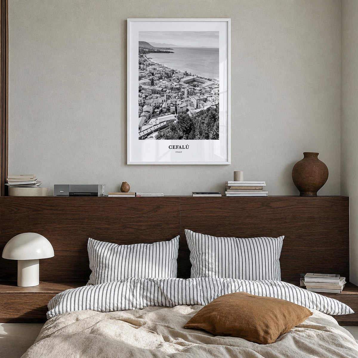 Cefalù black & white classic poster of Italy – vertical wall art in white wood frame, hanging on wall