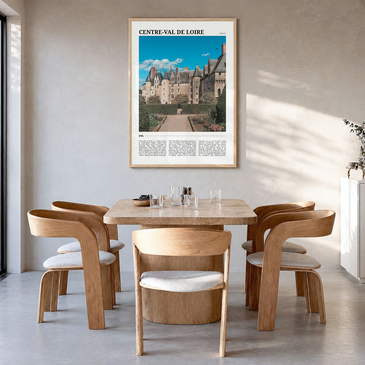 Centre-Val de Loire Travel Poster in a natural wood frame, hanging in a dining room