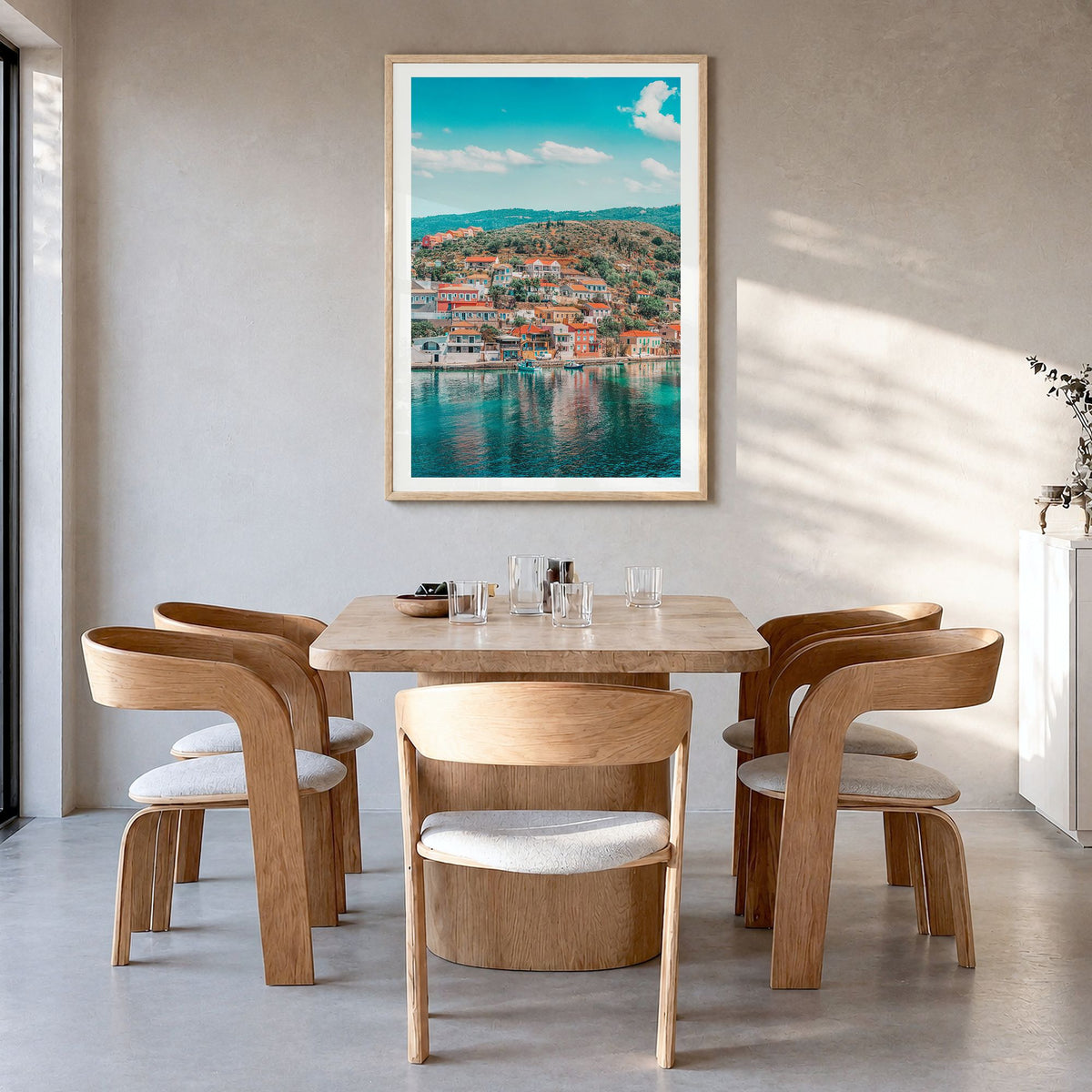 Cephalonia Photo Poster in a natural wood frame, hanging in a dining room, white border