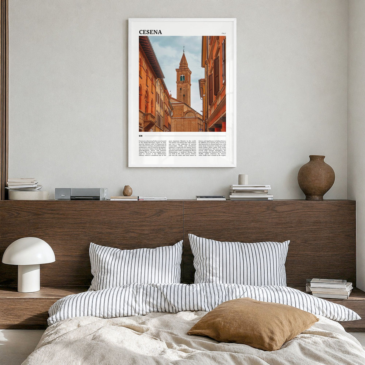 Cesena Travel Poster in a white wood frame, hanging in a bedroom