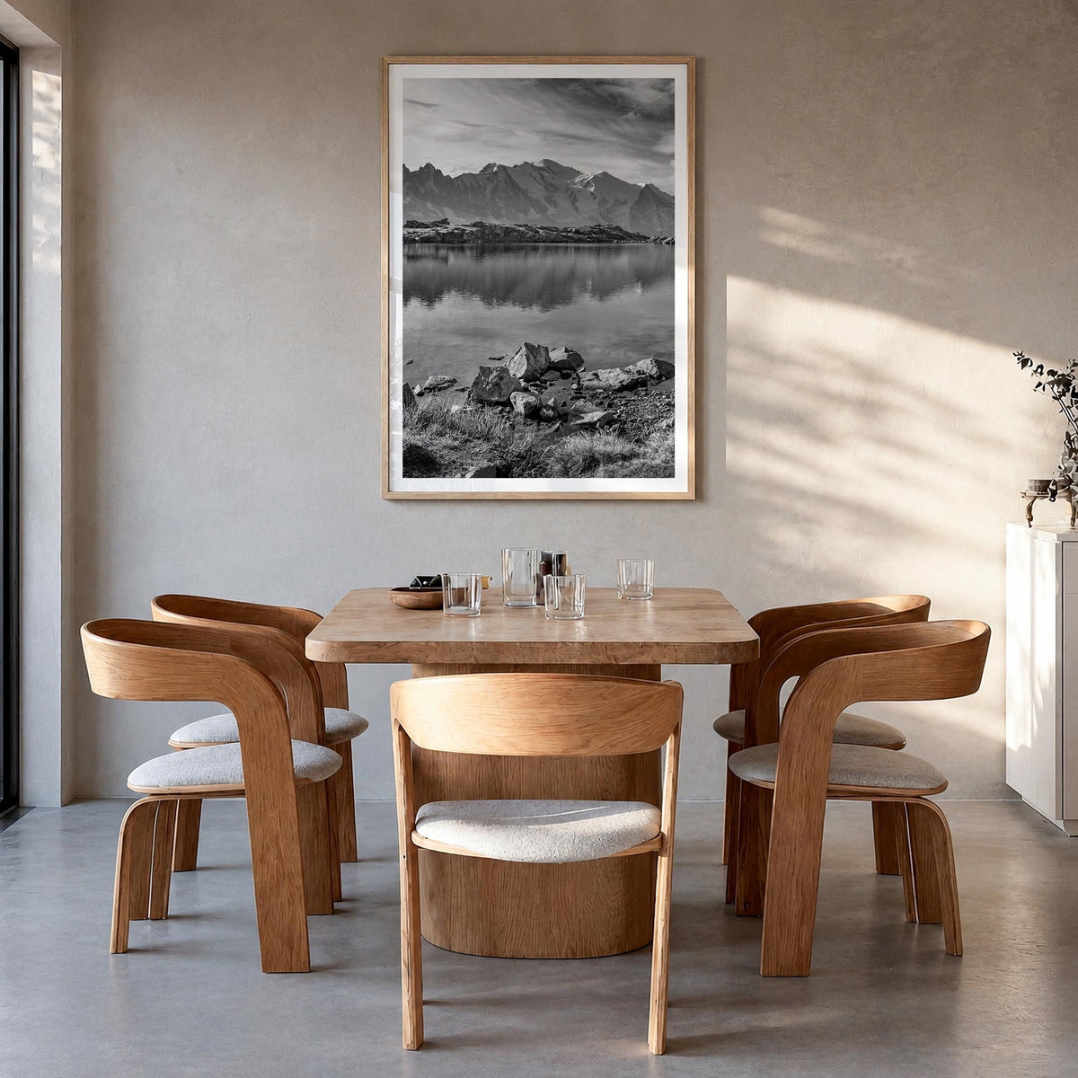Chamonix black & white photo poster of France – vertical wall art in natural wood frame with white border, hanging on wall