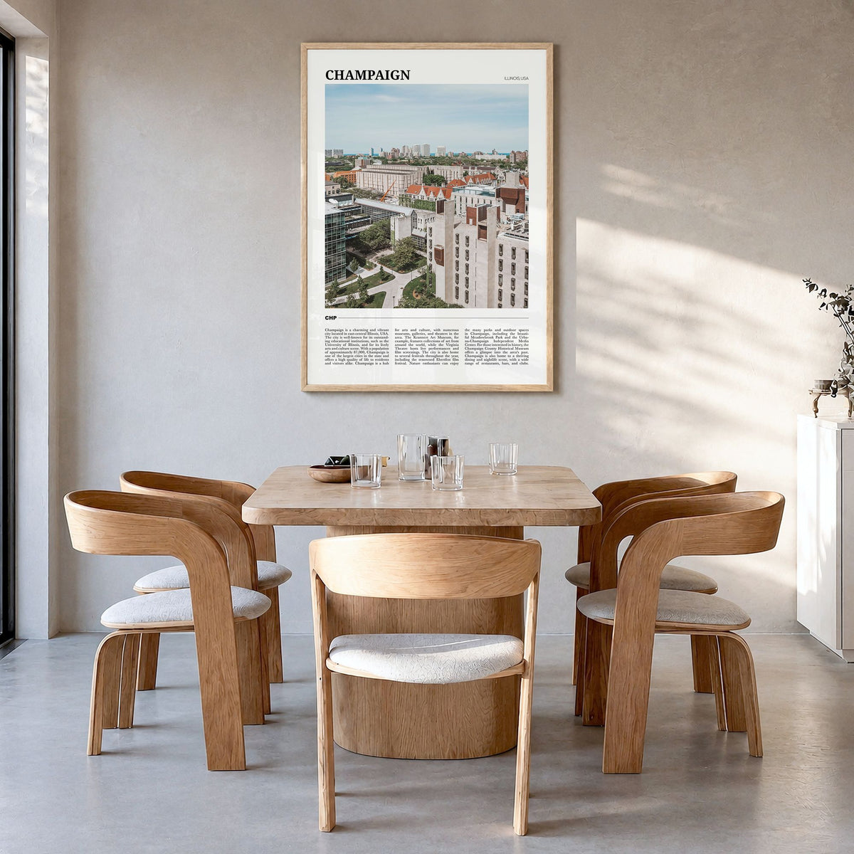 Champaign Travel Poster in a natural wood frame, hanging in a dining room