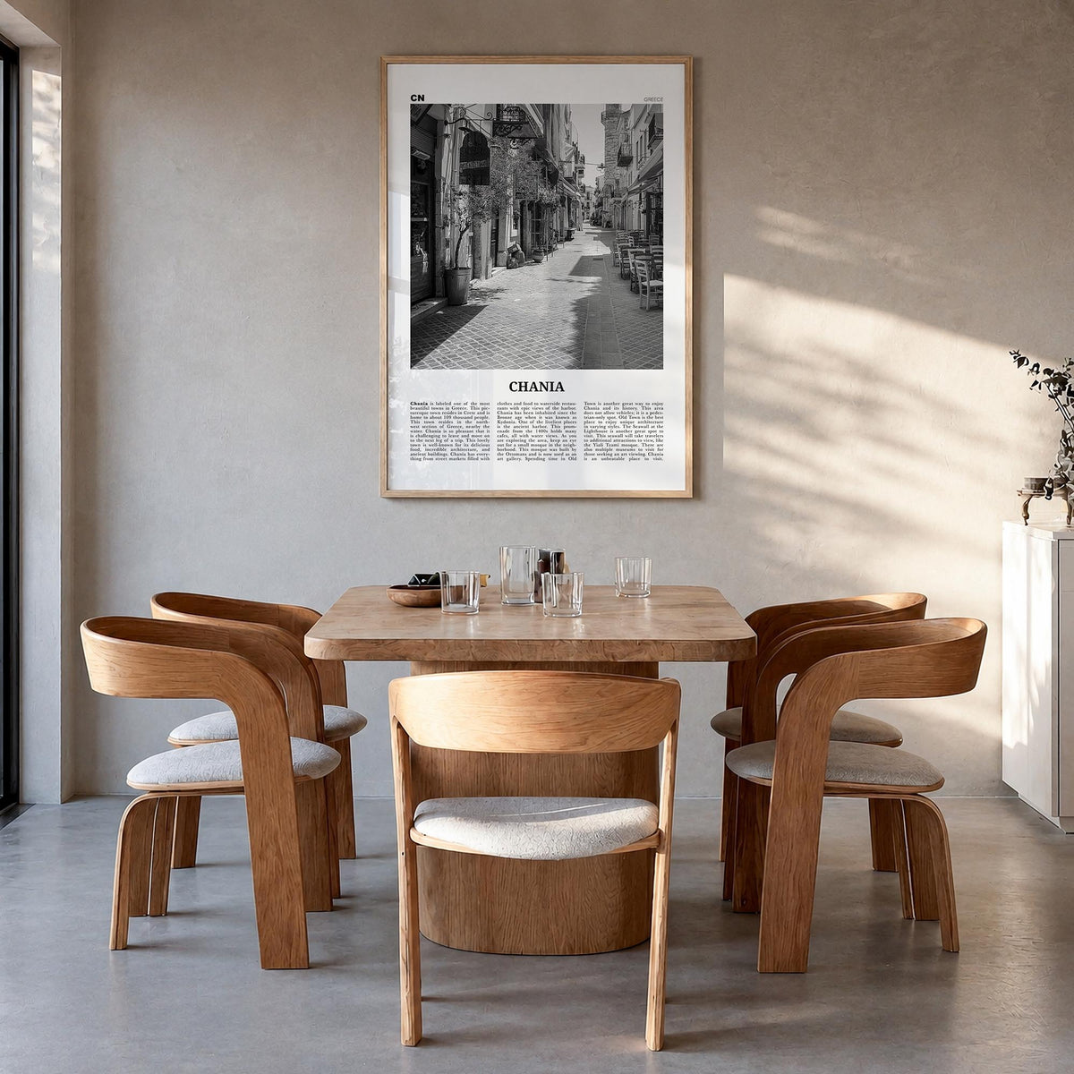 Chania black & white newspaper poster of Greece – vertical wall art in natural wood frame, hanging on wall