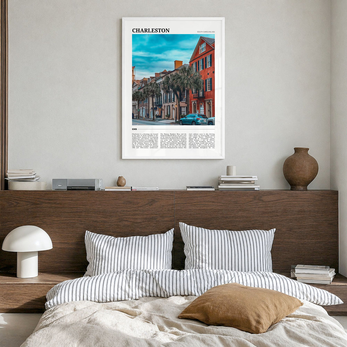 Charleston, South Carolina Travel No 1 Poster in a white wood frame, hanging in a bedroom