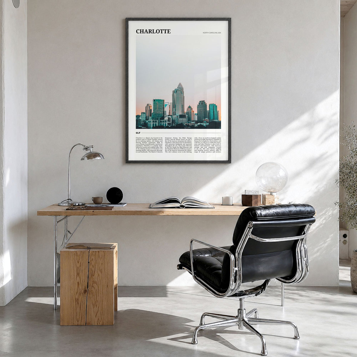 Charlotte Travel No 2 Poster in a black wood frame, hanging in a bright home office