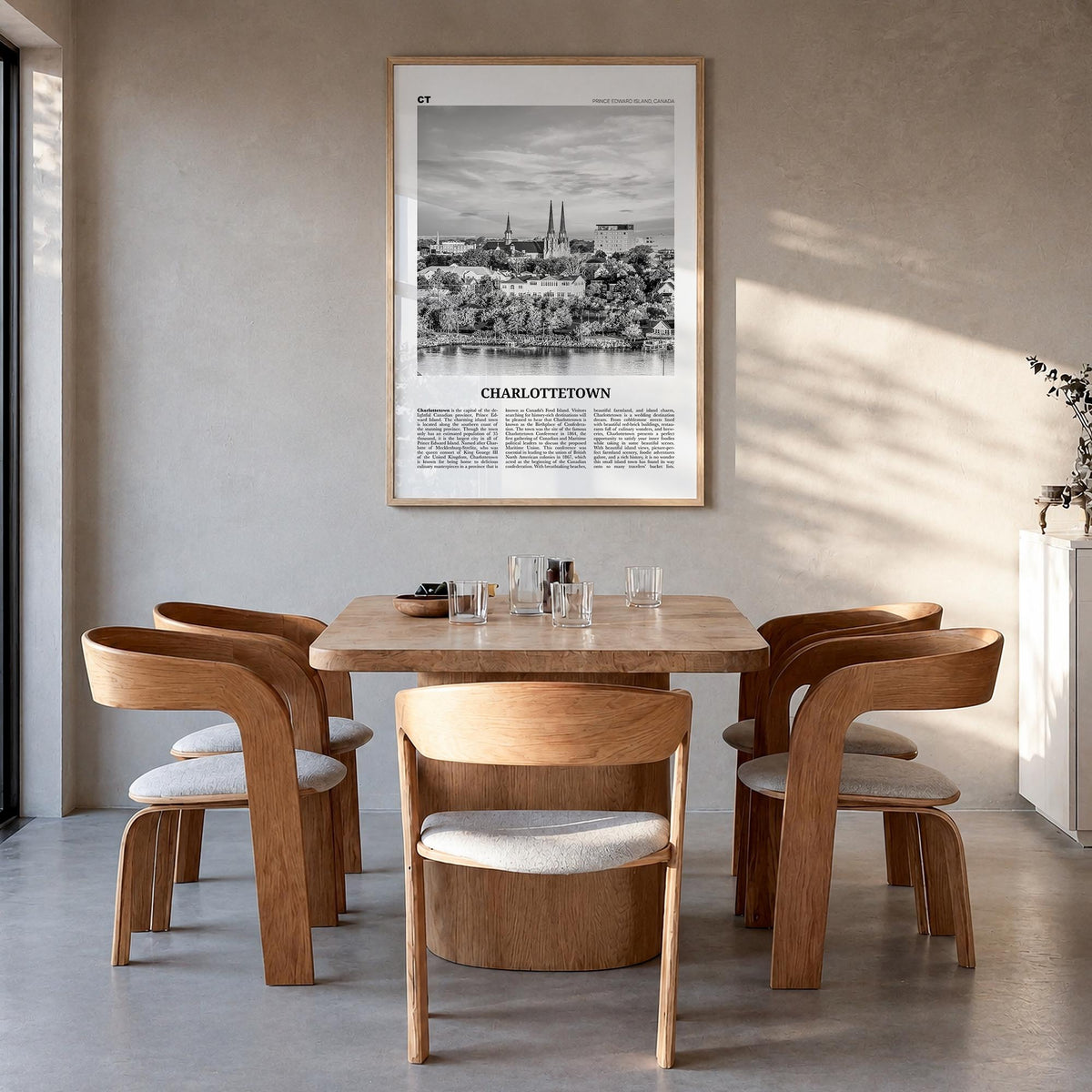 Charlottetown black & white newspaper poster of Canada – vertical wall art in natural wood frame, hanging on wall