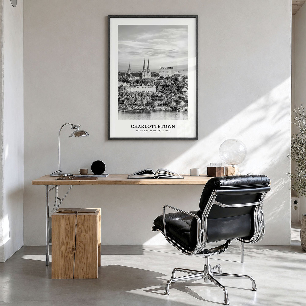 Charlottetown Classic Poster in a black wood frame, hanging in a bright home office